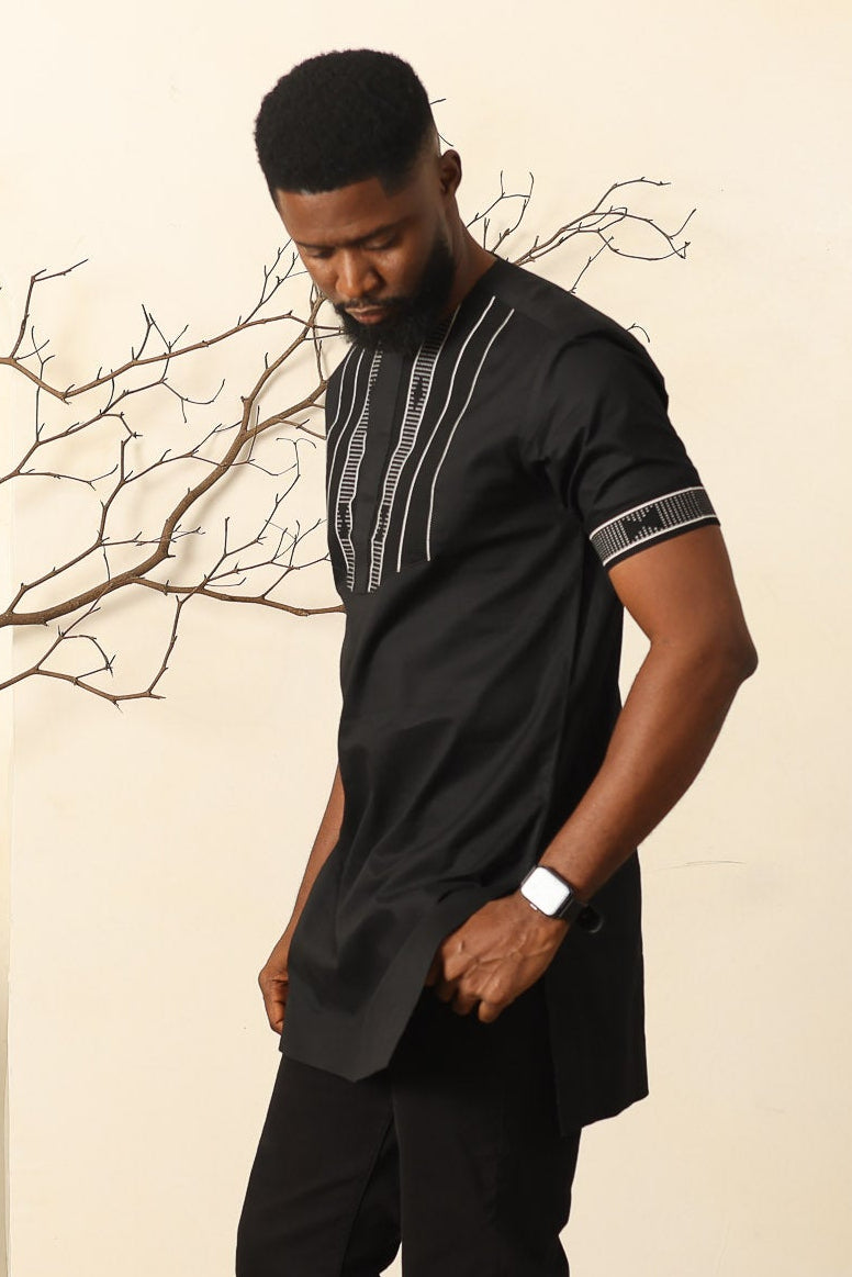 Man standing in Black African Print Tunic Shirt with Kente Detail
