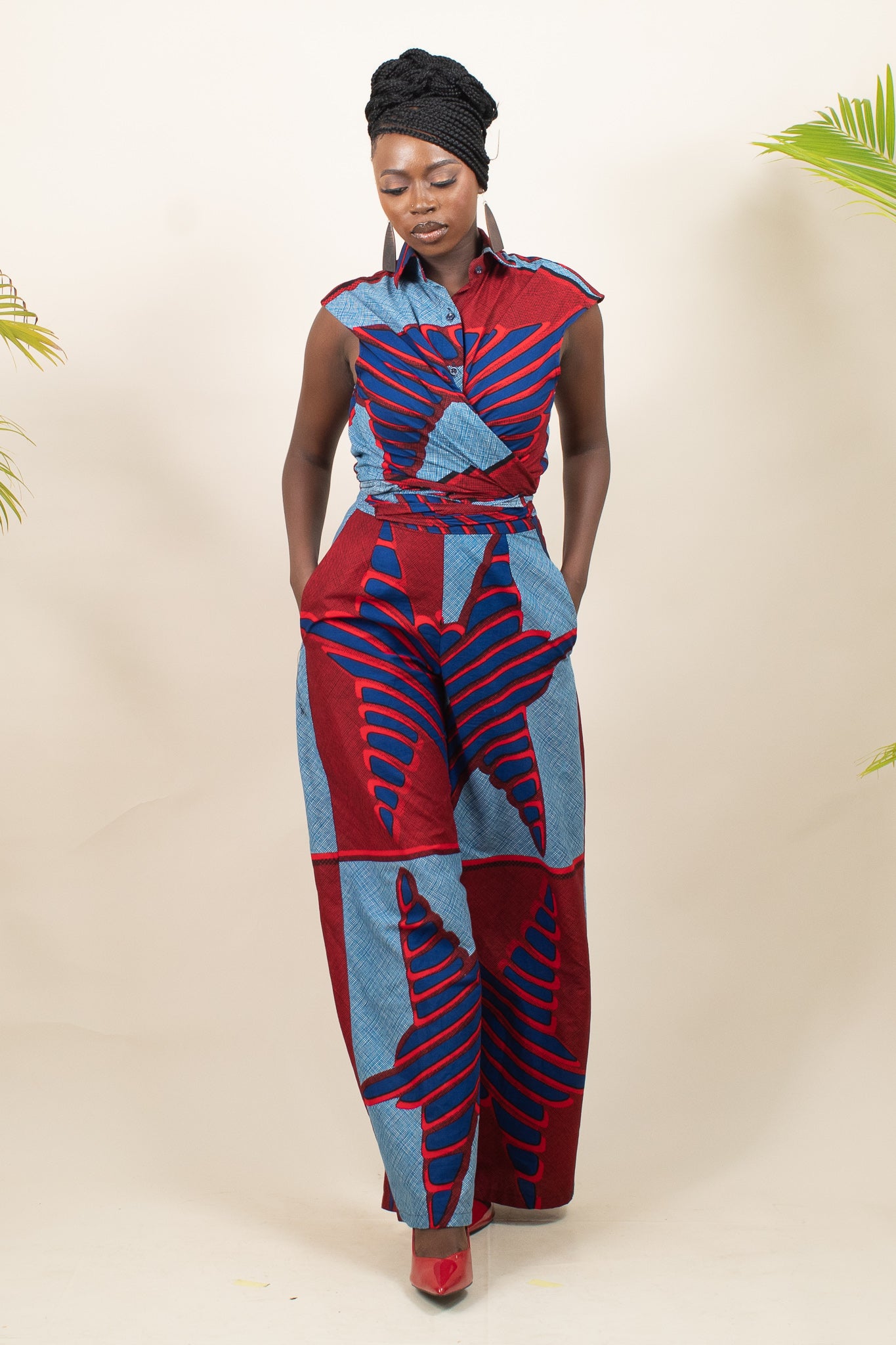 Woman wearing a Xolani African Print Ankara  red and blue patterned jumpsuit